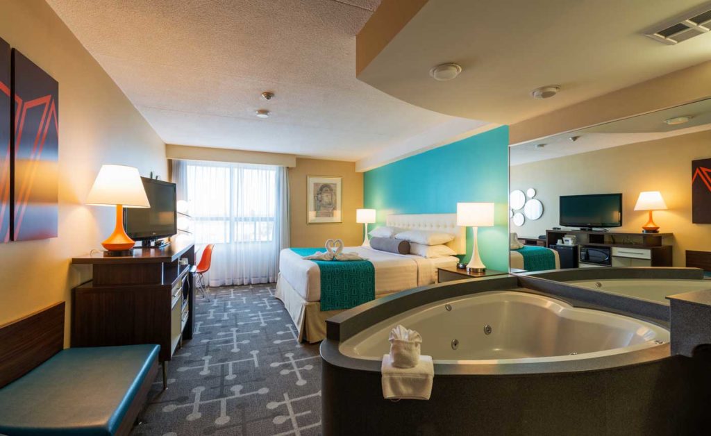 Howard Johnson hotel suite with king bed and Niagara Falls heart-shaped tub